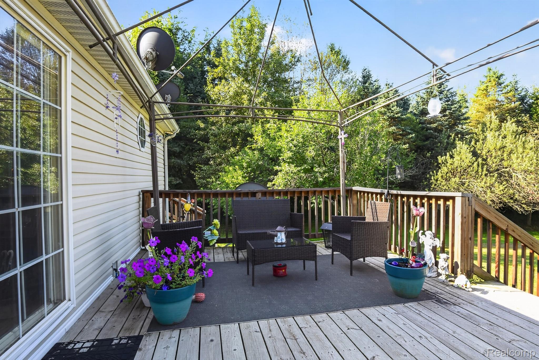 6266 Kikendall Road Eaton Rapids, MI 48827 - Photo 8 of 36 Wood-finish deck with a metal gazebo frame and wood railing
