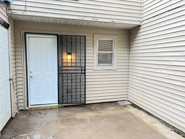 a view of a house with white door