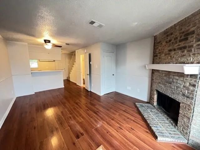 a bedroom with a bed and a fireplace