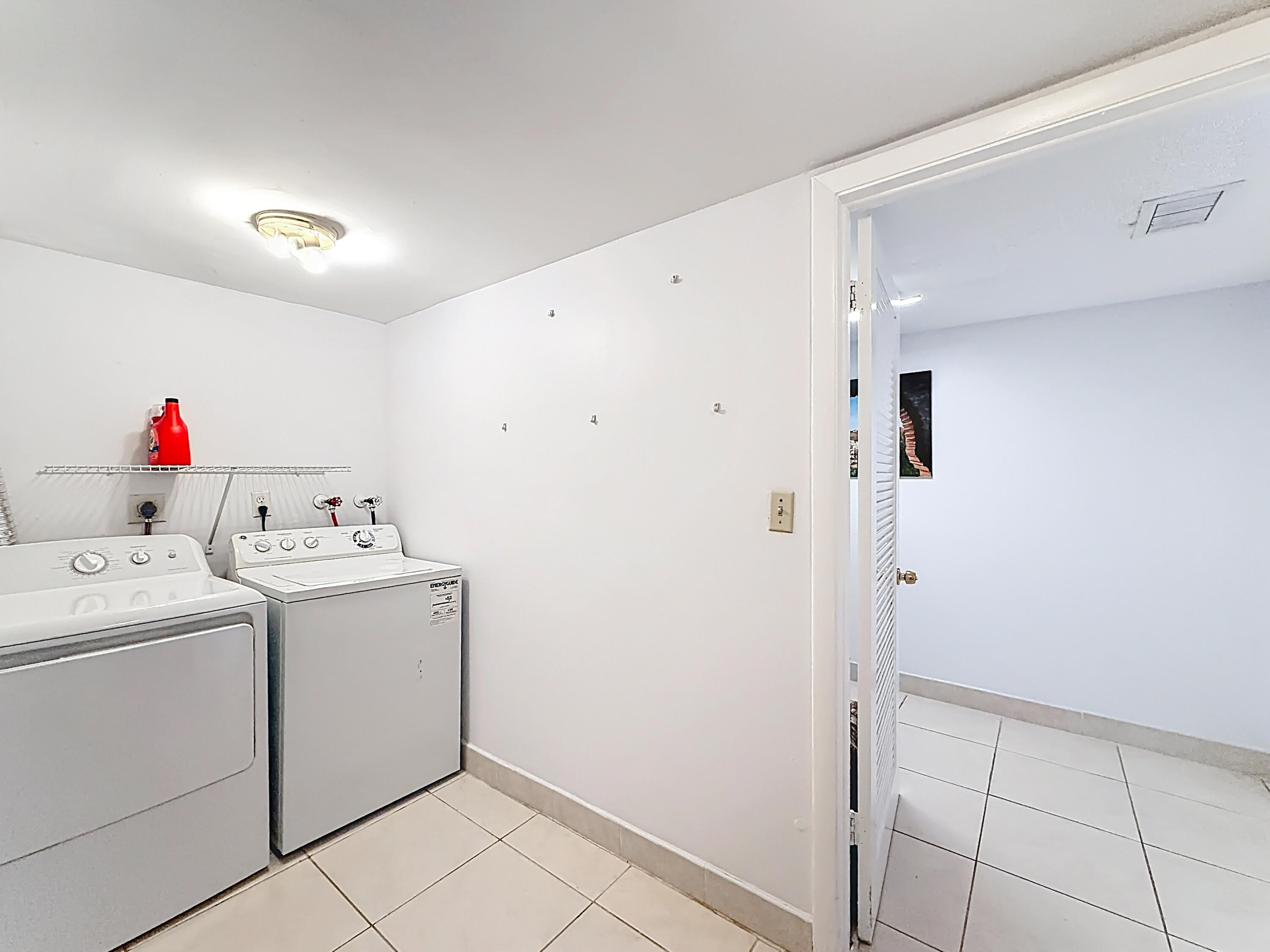 755 Dotterel Road, Unit 1411 Delray Beach, FL 33444 - Photo 29 of 51 755 Dotterel Road Laundry Room