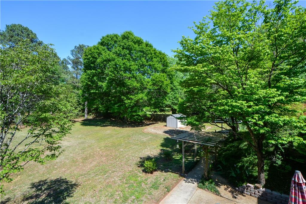 130 Hawn Road Fayetteville, GA 30215 - Photo 46 of 67 a backyard of a house with lots of green space