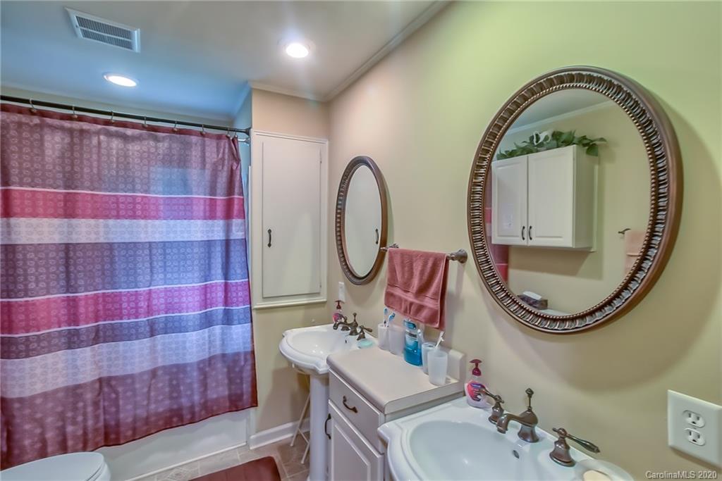 367 Potter Road Lancaster, SC 29720 - Photo 11 of 30 a bathroom with a sink and a mirror