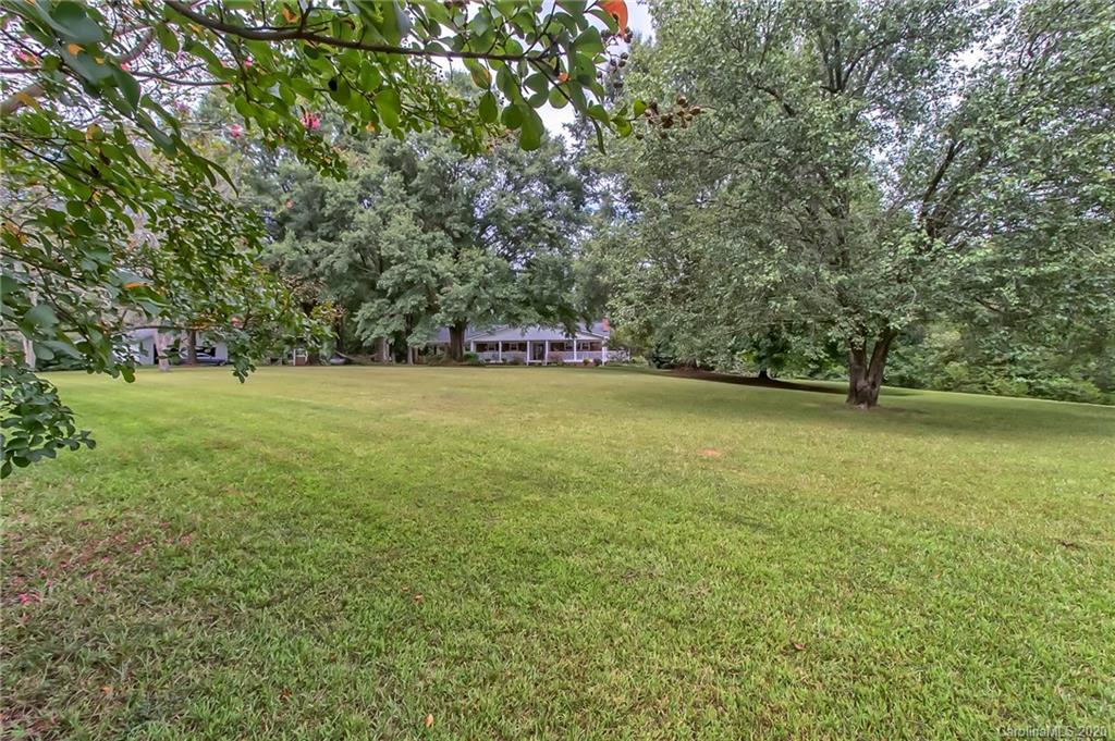 367 Potter Road Lancaster, SC 29720 - Photo 24 of 30 a view of a green yard with a tree