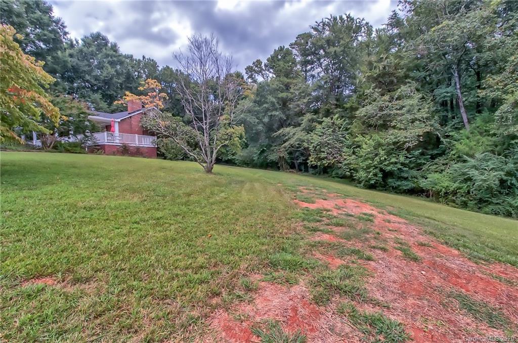 367 Potter Road Lancaster, SC 29720 - Photo 27 of 30 a backyard of a house with lots of green space