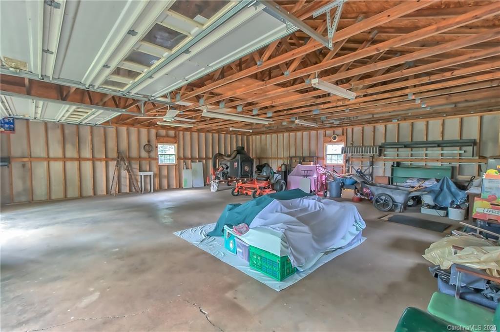 367 Potter Road Lancaster, SC 29720 - Photo 30 of 30 a bed room with lots of furniture and a chandelier