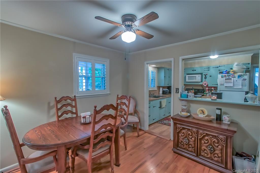 367 Potter Road Lancaster, SC 29720 - Photo 6 of 30 a view of a dining room with furniture and wooden floor