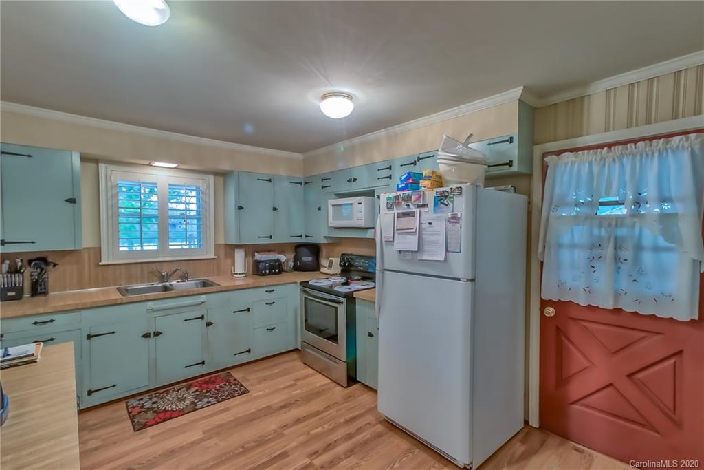 367 Potter Road Lancaster, SC 29720 - Photo 8 of 30 a kitchen with refrigerator and cabinets