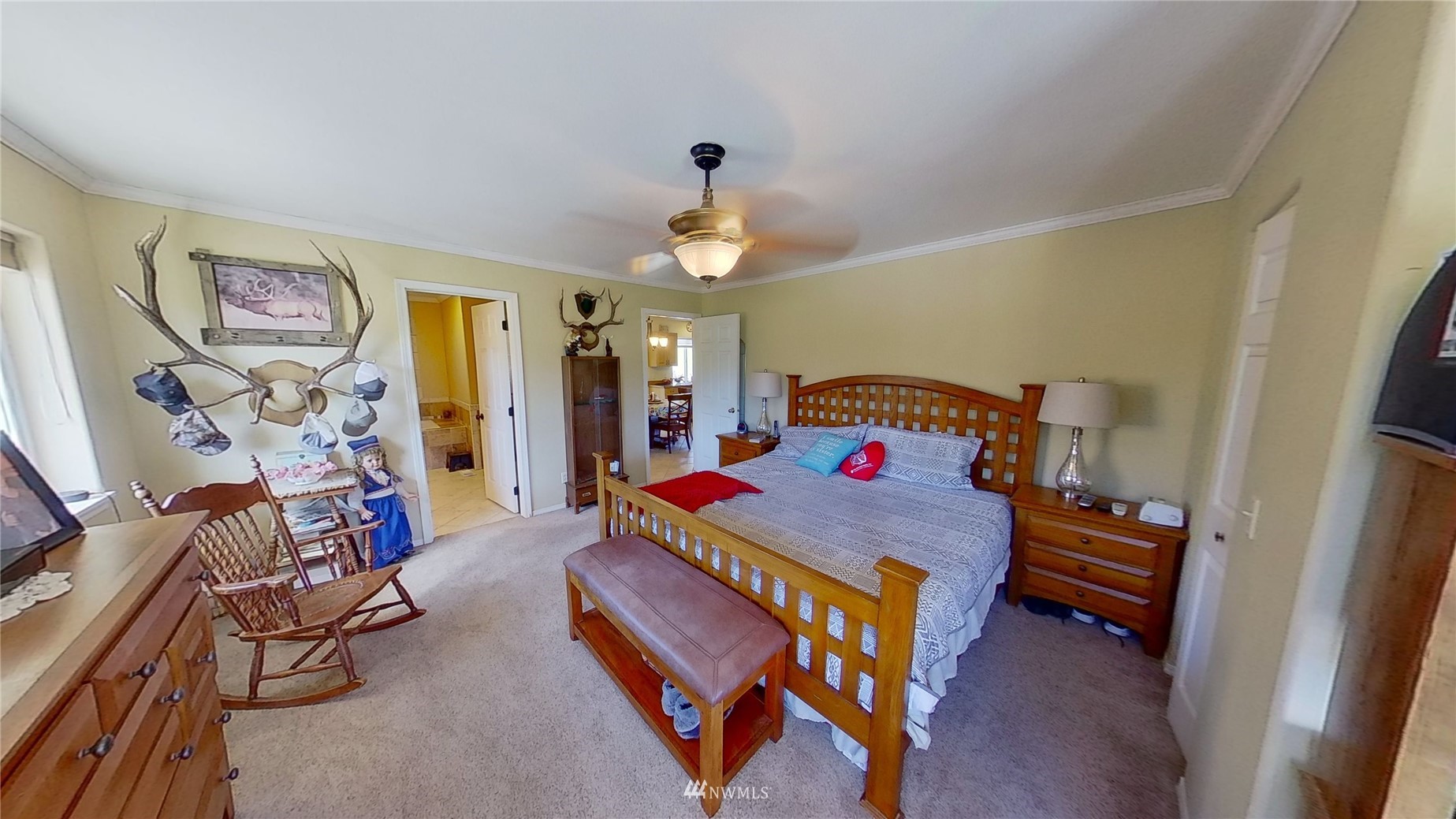 2855 Rock Island Road East Wenatchee, WA 98802 - Photo 13 of 30 a bedroom with a bed and a chandelier