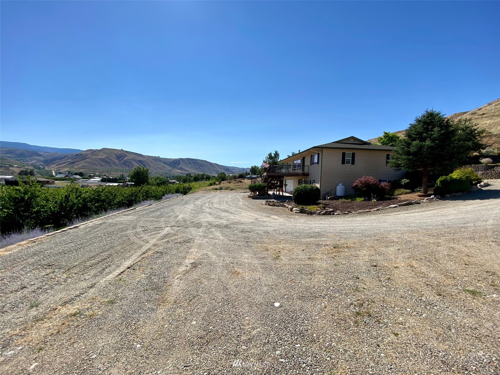 2855 Rock Island Road East Wenatchee, WA 98802 - Photo 26 of 30 a view of backyard of a house with an outdoor space and seating