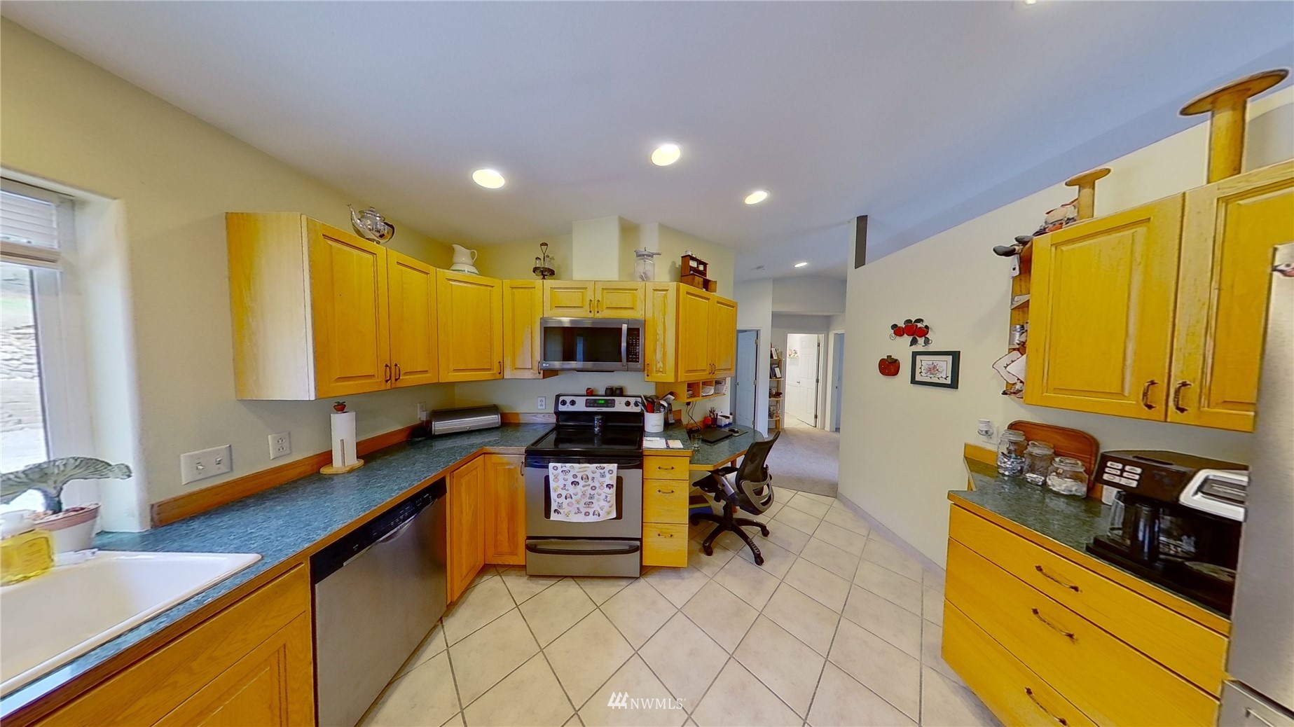2855 Rock Island Road East Wenatchee, WA 98802 - Photo 6 of 30 a kitchen with stainless steel appliances kitchen island granite countertop a sink and cabinets