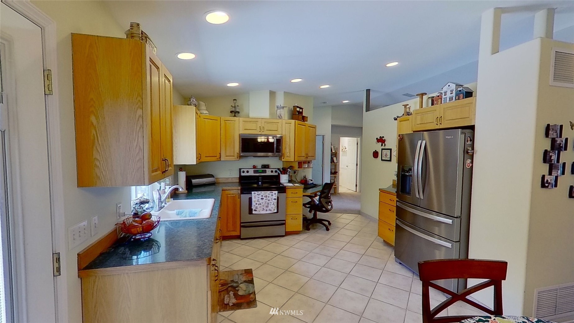 2855 Rock Island Road East Wenatchee, WA 98802 - Photo 7 of 30 a kitchen view with furniture a refrigerator and a view of living room
