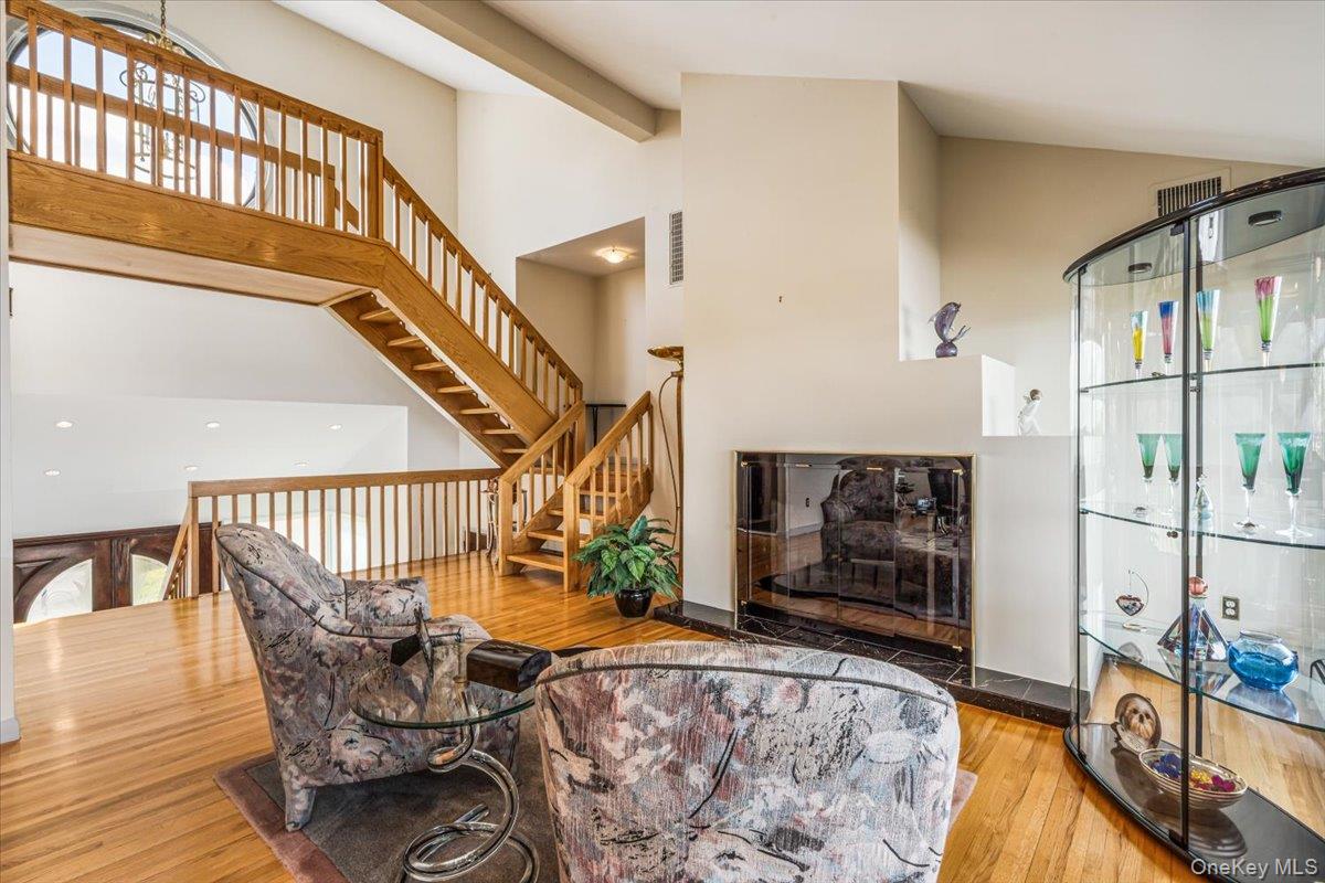 154-43 Riverside Drive Queens, NY 11357 - Photo 8 of 41 a view of a livingroom with furniture and staircase