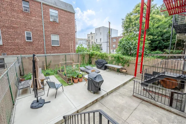 a view of a patio with couches table and chairs with potted plants