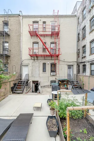 a view of a patio with couches table and chairs