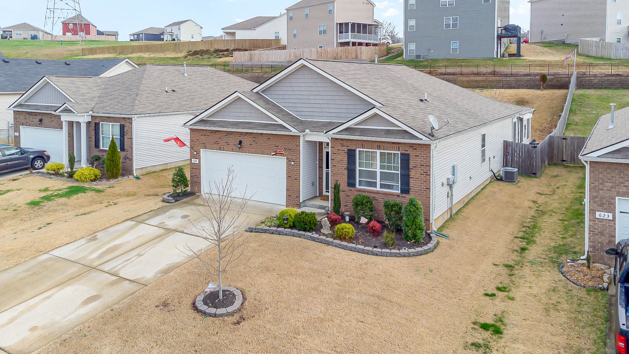 a view of a house with a backyard and a garage