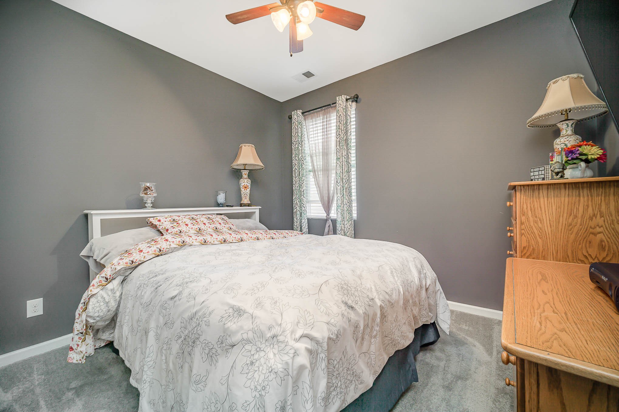 619 Prominence Road Columbia, TN 38401 - Photo 7 of 19 a large bed sitting in a bedroom next to a lamp