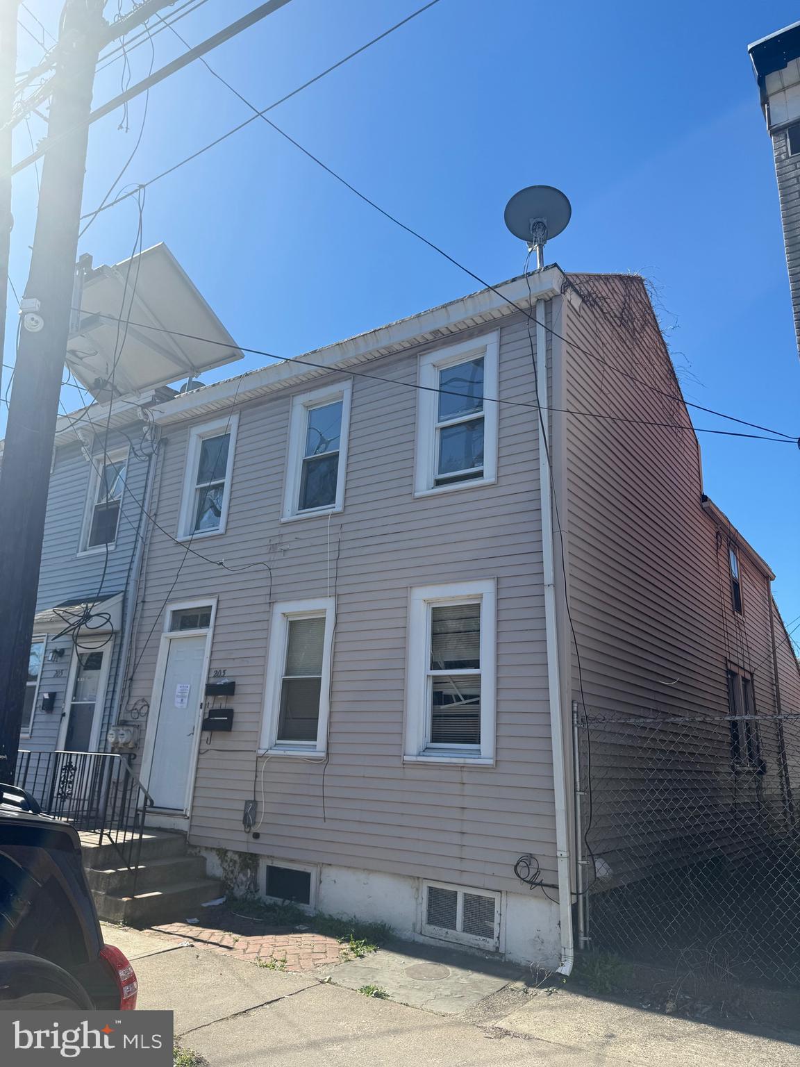 203 Genesee Street, Unit 2 Trenton, NJ 08611 - Photo 1 of 5 a front view of a building with parking space