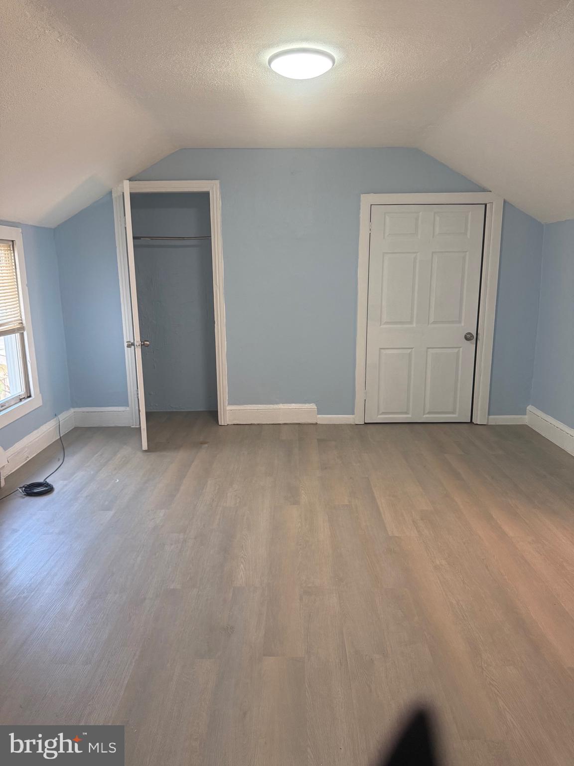 203 Genesee Street, Unit 2 Trenton, NJ 08611 - Photo 2 of 5 an empty room with windows