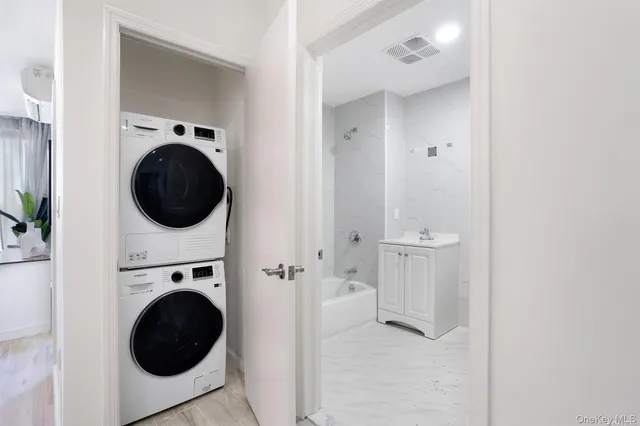 a view of a hallway with washer and dryer