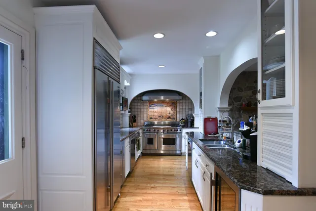 a view of a porch with a floor to ceiling window and a yard