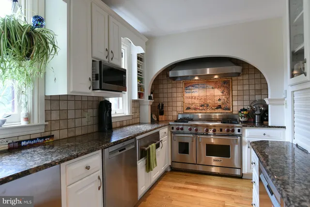 a bathroom with a sink toilet and a mirror