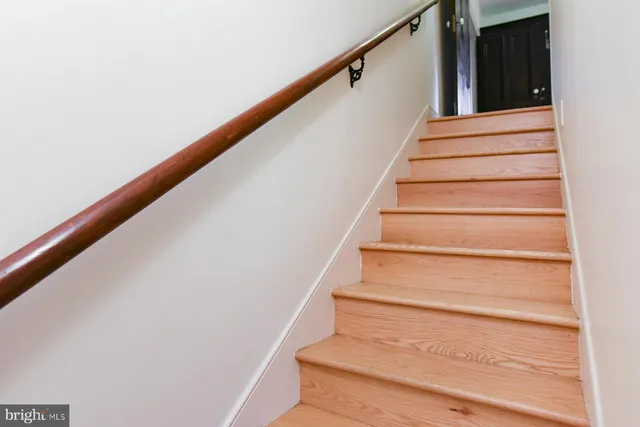 a view of swimming pool with a garden and trees