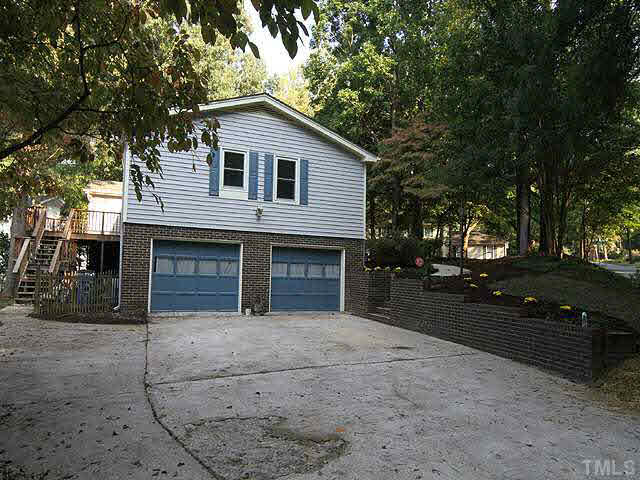 5521 Mapleridge Road Raleigh, NC 27609 - Photo 24 of 24 a front view of a house with a yard