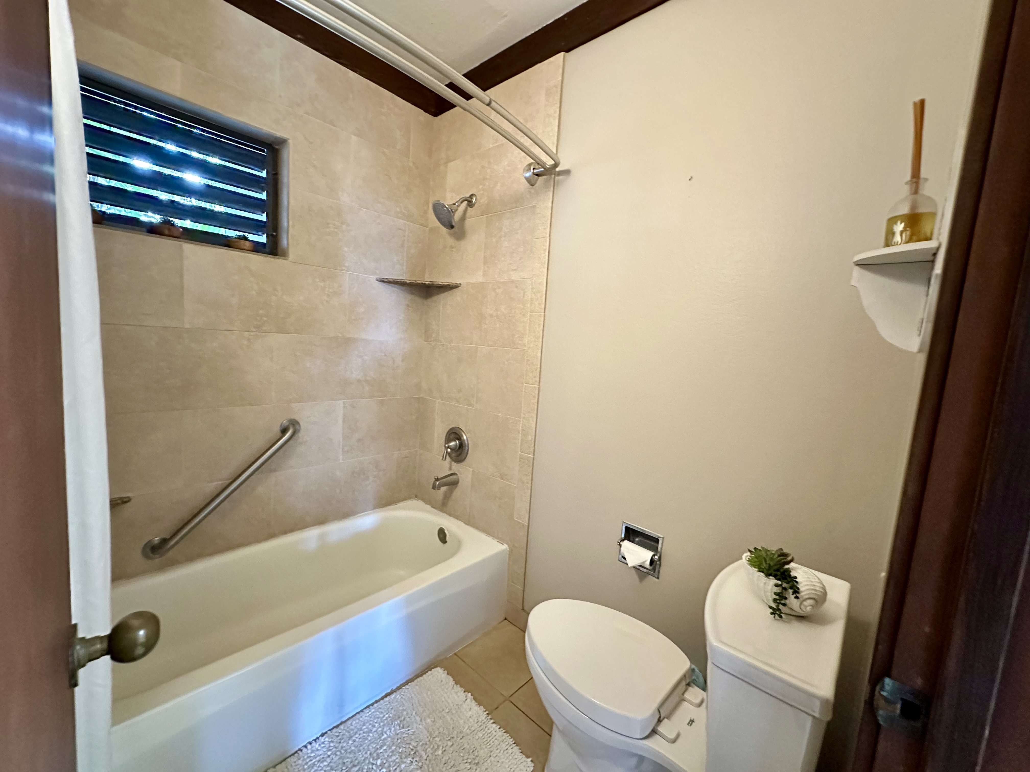 2253 Poipu Road, Unit 91 Koloa, HI 96756 - Photo 12 of 14 a bathroom with a sink a toilet and shower