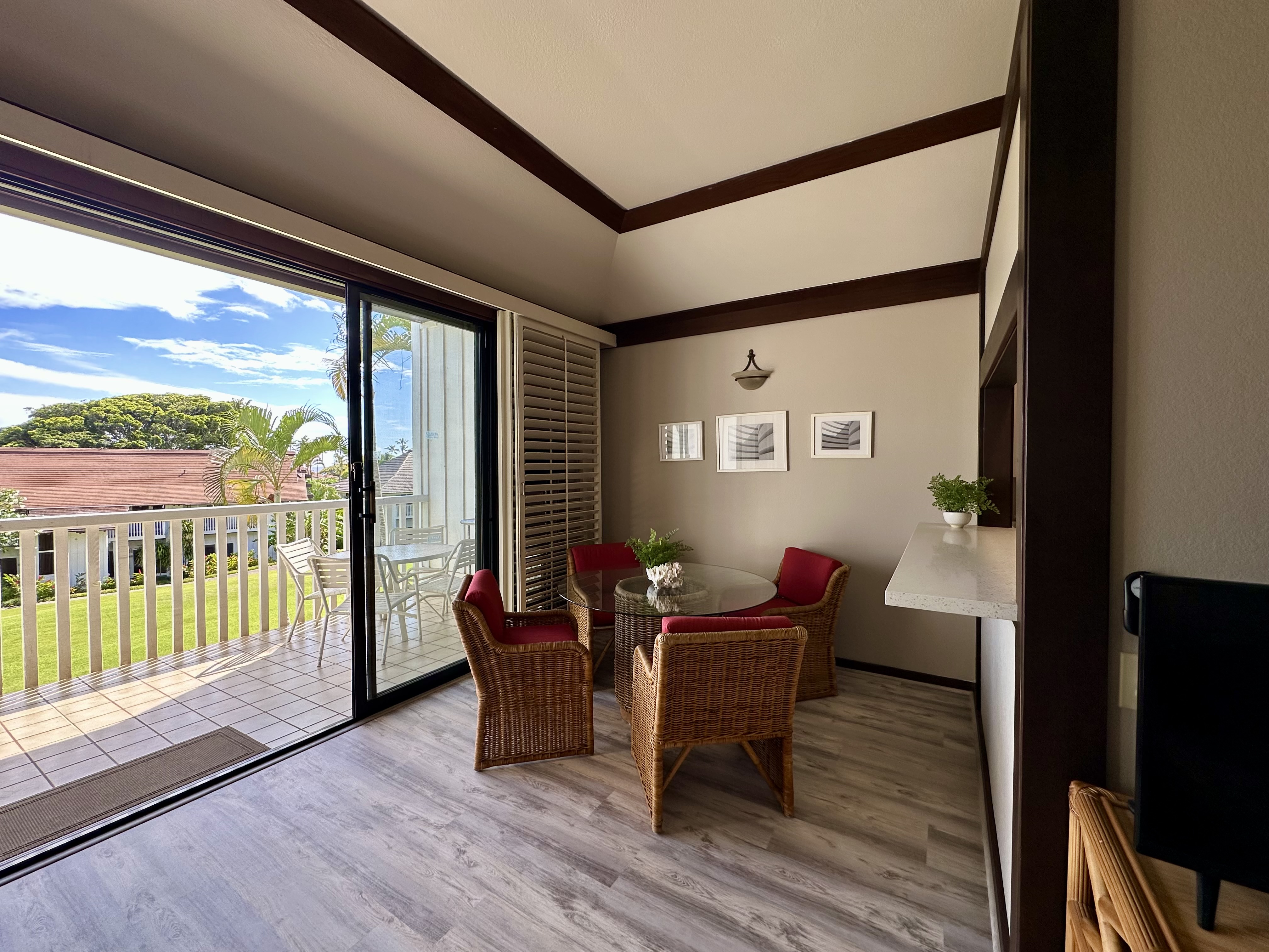 2253 Poipu Road, Unit 91 Koloa, HI 96756 - Photo 5 of 14 a living room with furniture and a floor to ceiling window