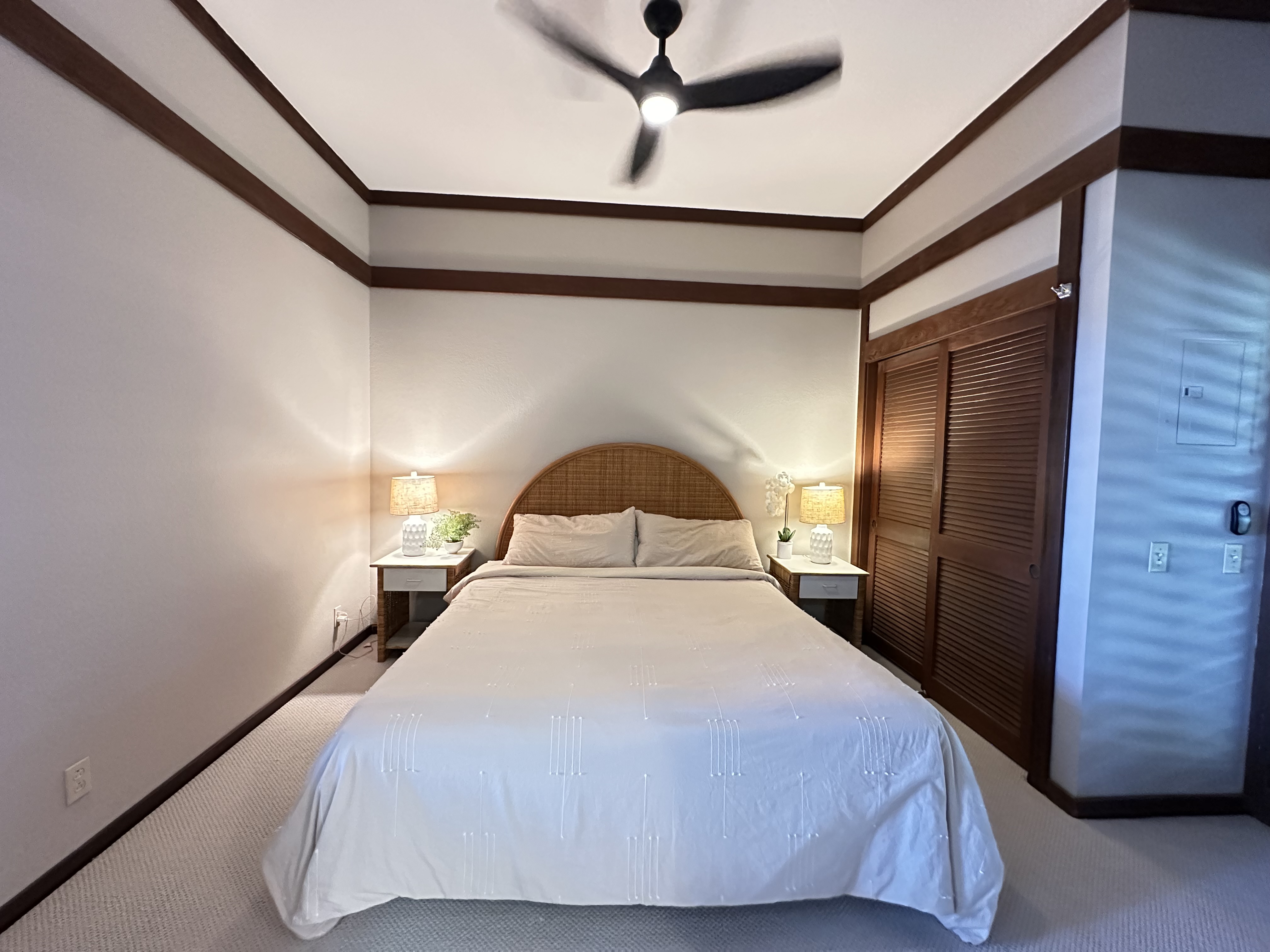 2253 Poipu Road, Unit 91 Koloa, HI 96756 - Photo 9 of 14 a bedroom with a bed and a dresser