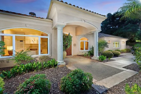 a view of a house with a park