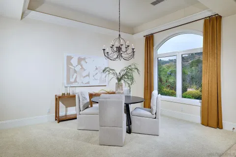 a kitchen with stainless steel appliances kitchen island granite countertop a refrigerator and cabinets