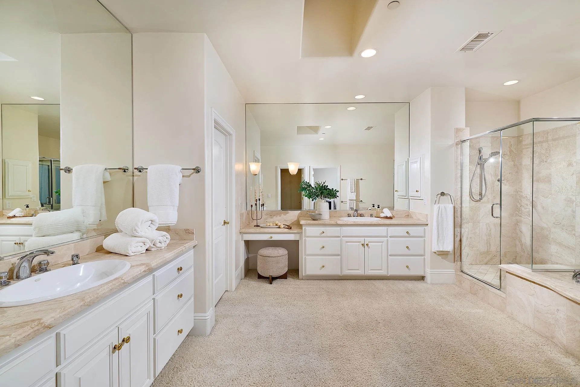 1691 Tecalote Drive Fallbrook, CA 92028 - Photo 21 of 45 a bathroom with double vanity sink a mirror a bathtub and shower