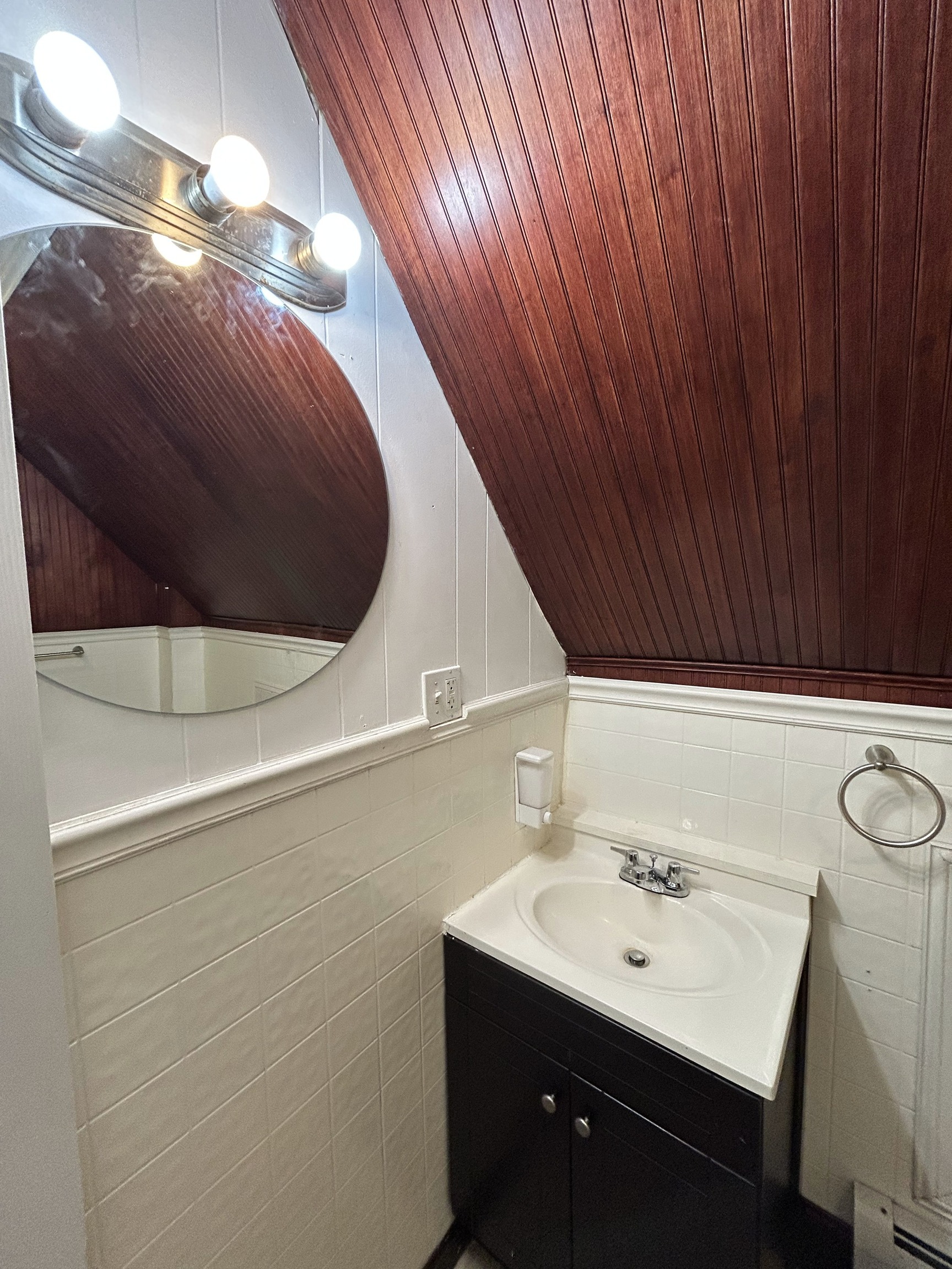 126 Boswell Avenue, Unit 2 Norwich, CT 06360 - Photo 11 of 27 a bathroom with a sink and mirror