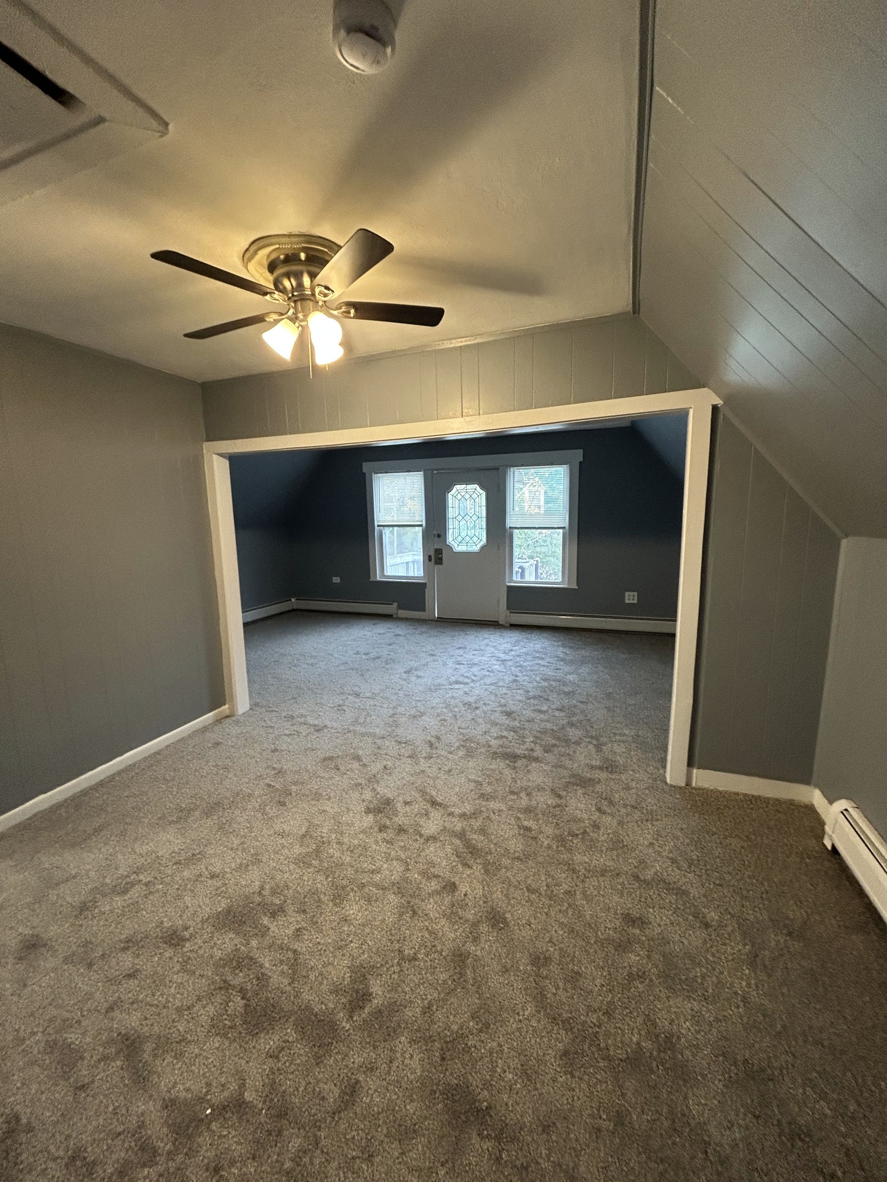 126 Boswell Avenue, Unit 2 Norwich, CT 06360 - Photo 15 of 27 a view of a livingroom with a ceiling fan and window