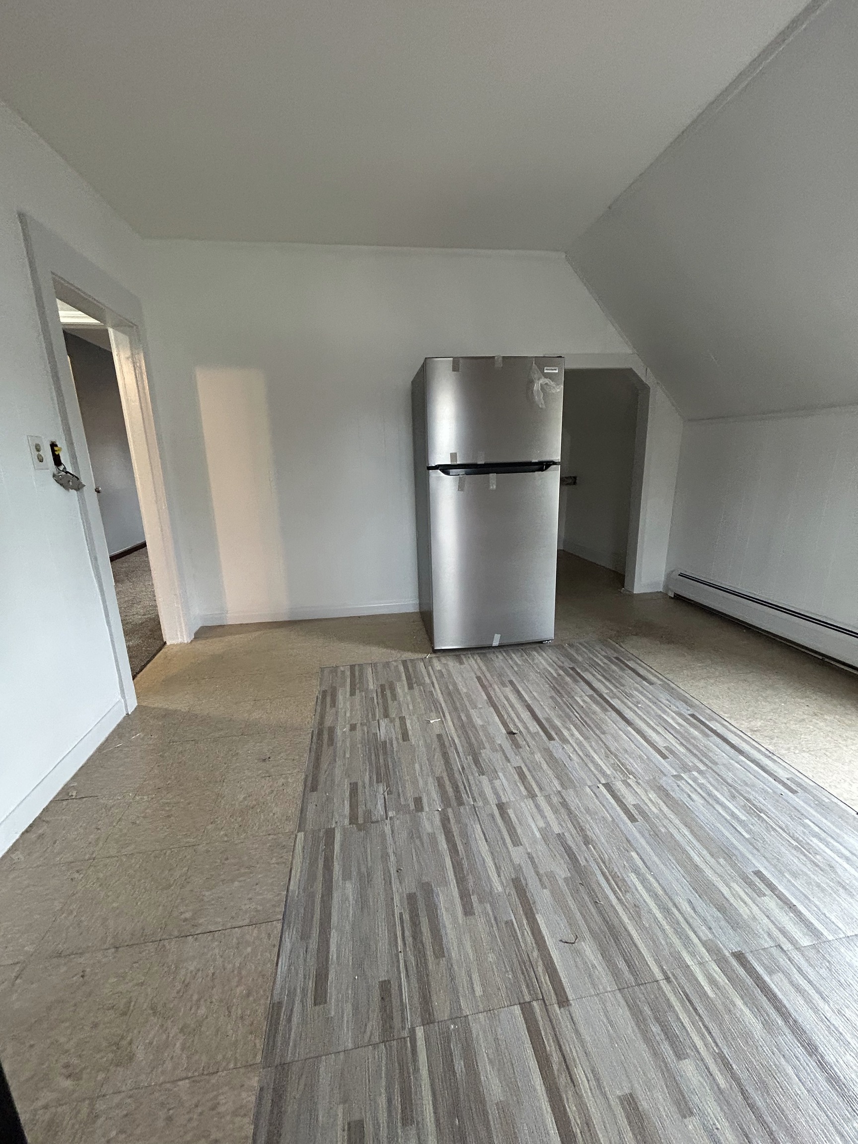 126 Boswell Avenue, Unit 2 Norwich, CT 06360 - Photo 19 of 27 a view of empty room with wooden floor and electronic appliances
