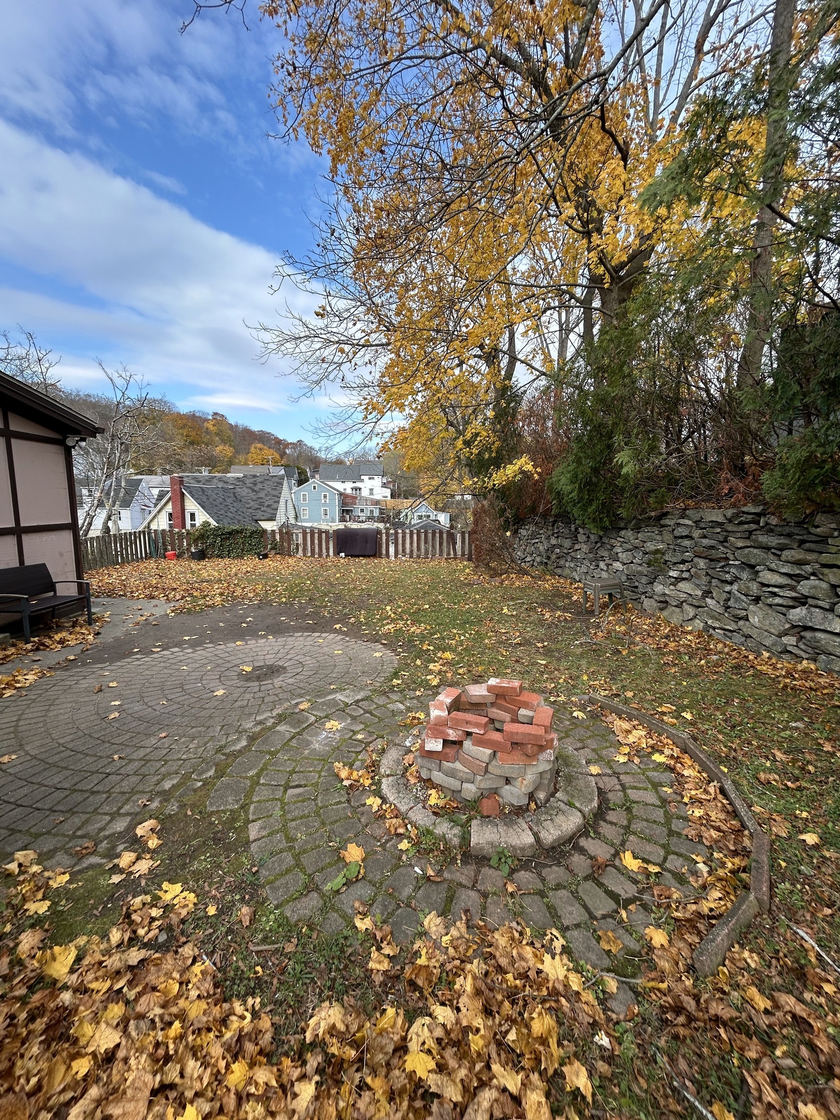126 Boswell Avenue, Unit 2 Norwich, CT 06360 - Photo 2 of 27 a backyard of a house with table and chairs