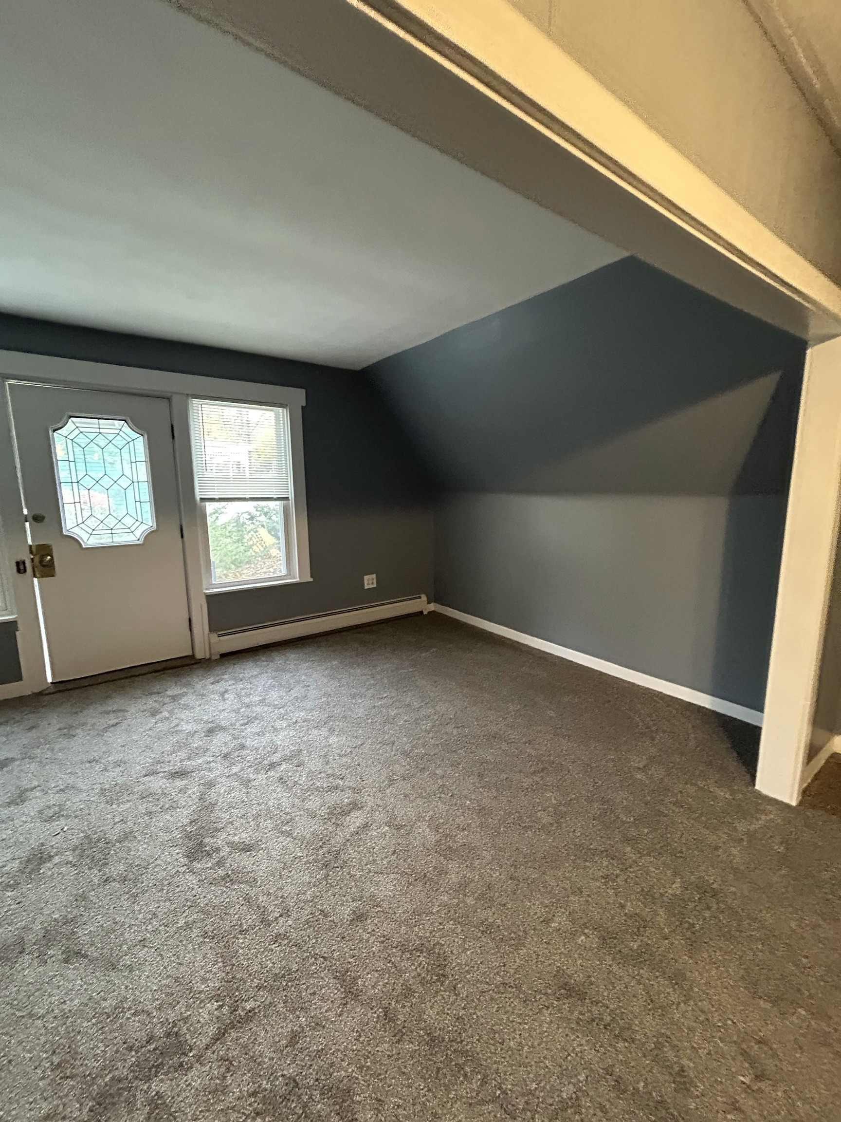 126 Boswell Avenue, Unit 2 Norwich, CT 06360 - Photo 7 of 27 an empty room with windows