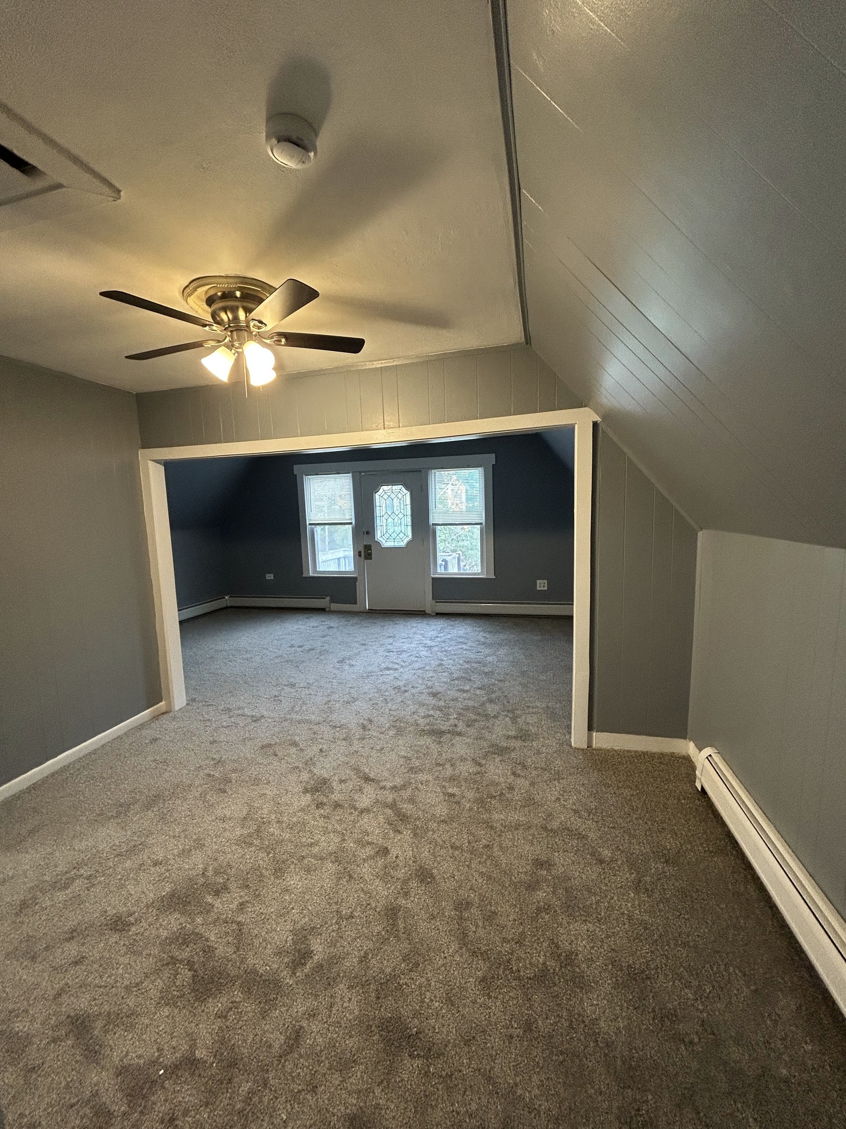 126 Boswell Avenue, Unit 2 Norwich, CT 06360 - Photo 9 of 27 a view of a livingroom with a ceiling fan and window