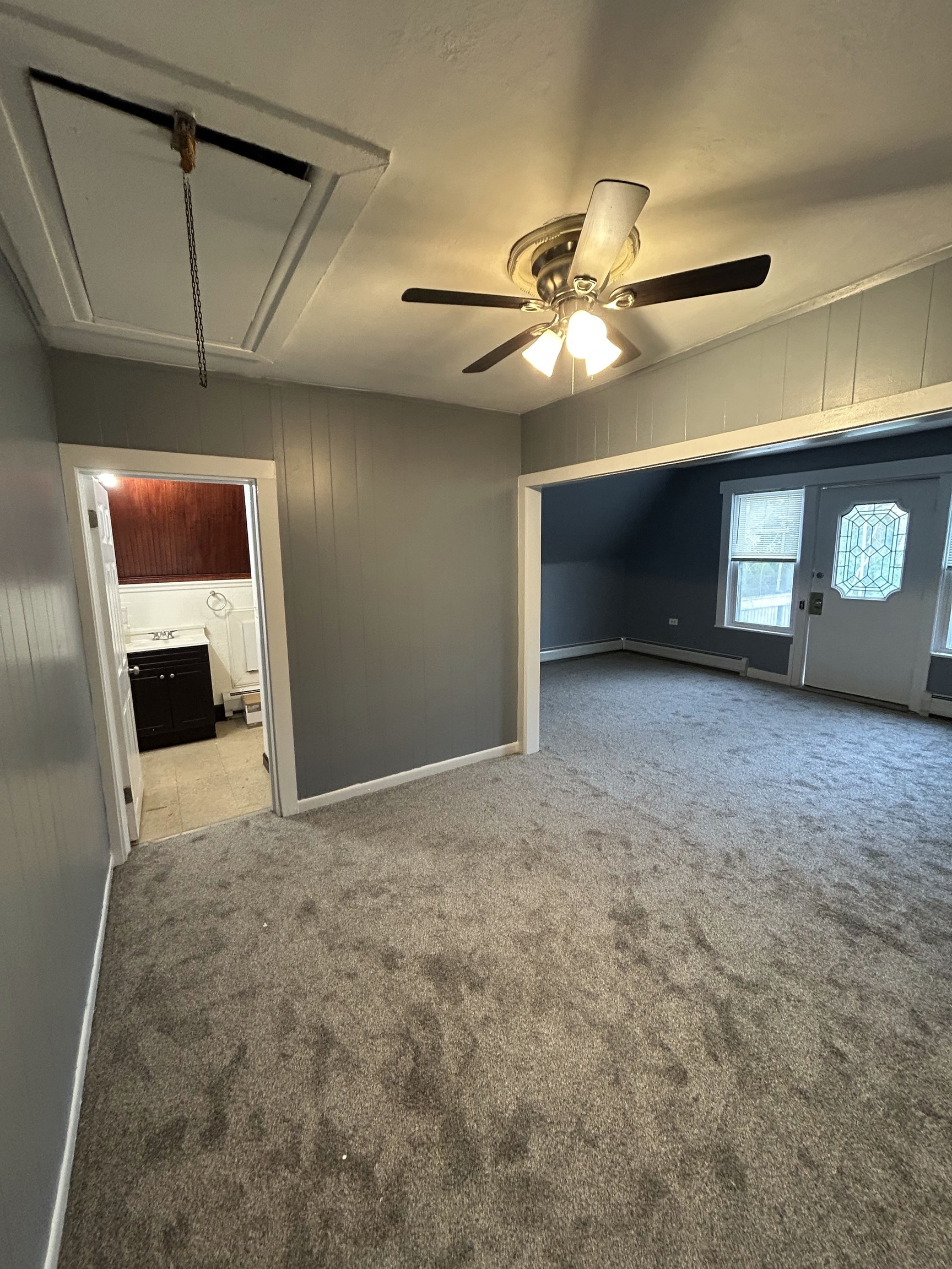 126 Boswell Avenue, Unit 2 Norwich, CT 06360 - Photo 10 of 27 a view of empty room with windows and ceiling fan