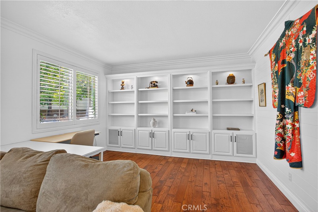 31928 Cercle Chambertin Temecula, CA 92591 - Photo 29 of 74 a living room with furniture and a book shelf