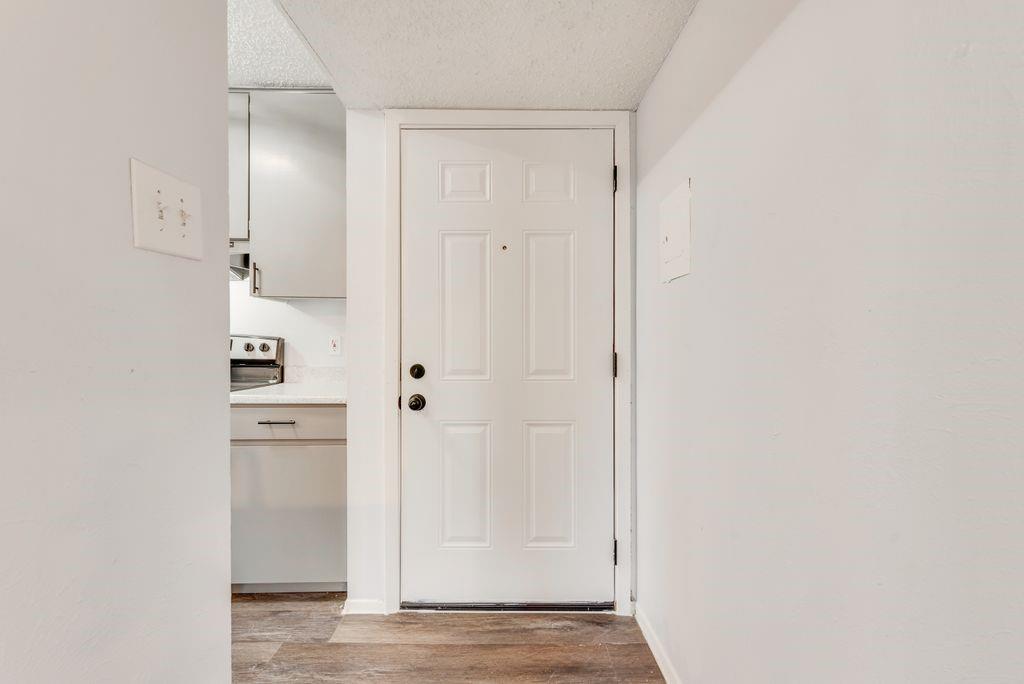 5514 Boca Raton Boulevard, Unit 438 Fort Worth, TX 76112 - Photo 2 of 25 a view of cabinets and wooden floor