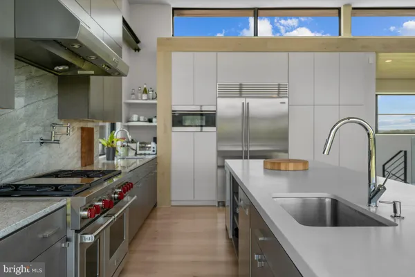 a kitchen with a large window