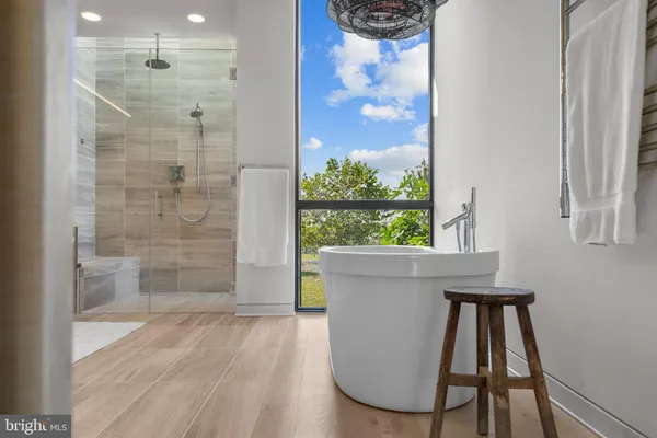 a living room with a large window and table
