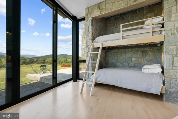 a view of a bedroom with a large window