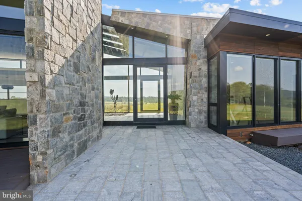 a view of a brick house with a large windows