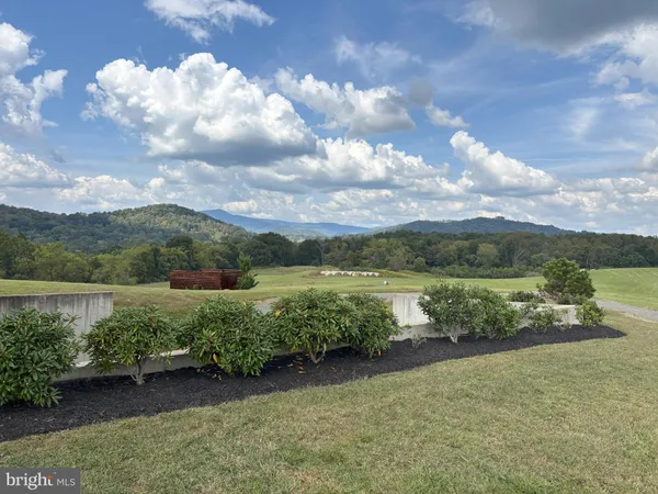 a view of a lake with a yard