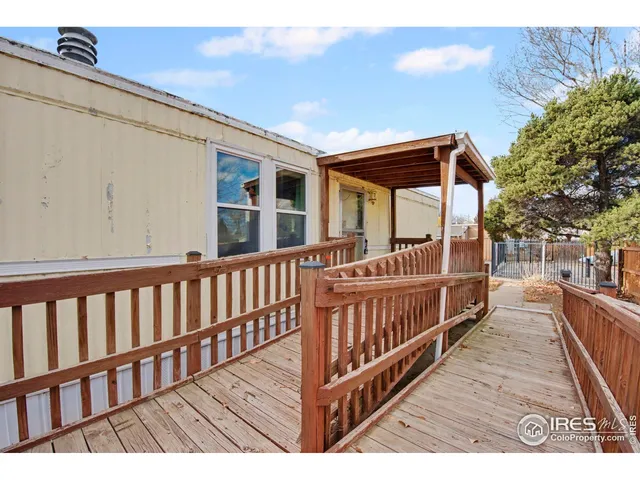 a view of a porch with wooden floor