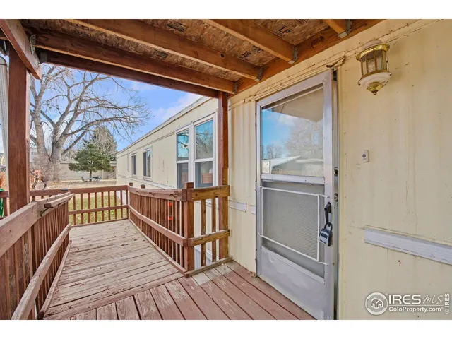 a view of a balcony with wooden floor