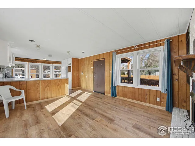 a view of livingroom with furniture wooden floor and window